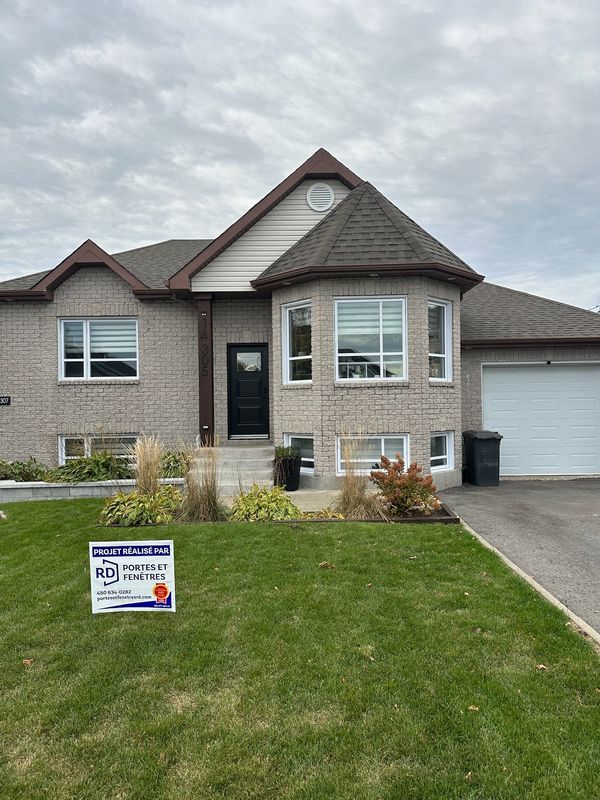 Professional spray painted home exterior in Alberta